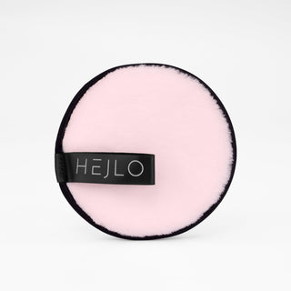 Rundes, rosa Kosmetik-Pad it schwarzem Rand und HEJLO-Logo auf hellem Hintergrund